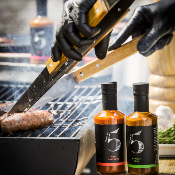 Chilli No. 5 hot sauce enhancing the flavors of a sizzling BBQ grill while providing health-promoting ingredients and superfoods